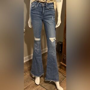 Ripped bell bottom jeans